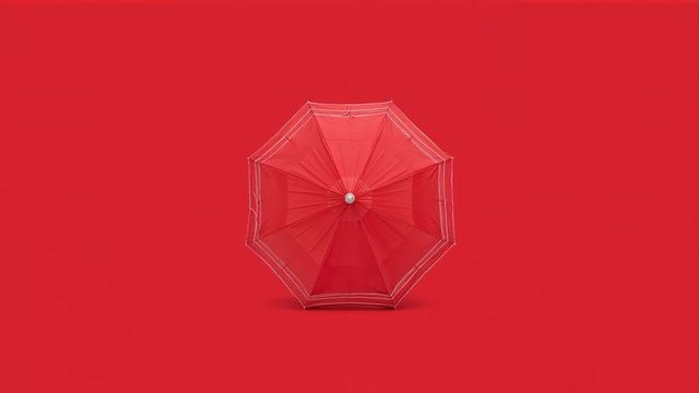 Minimalist Composition with Red Umbrella on Solid Background