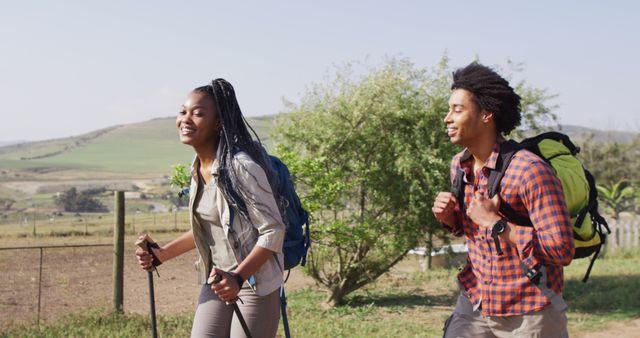 Young African American Couple Hiking in Countryside on Sunny Day - Download Free Stock Images Pikwizard.com