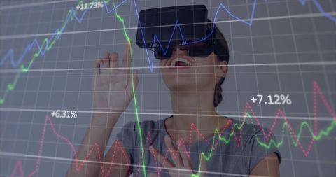 Businesswoman Engaging with Financial Data in Virtual Reality - Download Free Stock Images Pikwizard.com