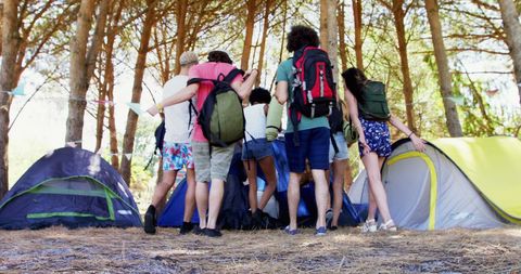 Group Hiking to Campsite in Woodland Park