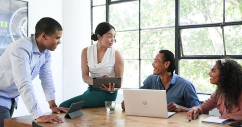Diverse Office Team Engaging in Collaborative Discussion