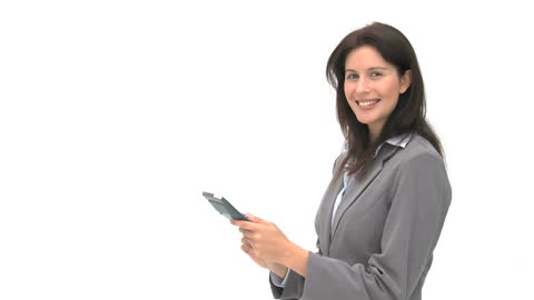 Confident Businesswoman Engaging with Tablet Technology