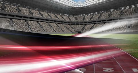 Light trails on racing track in empty sports stadium