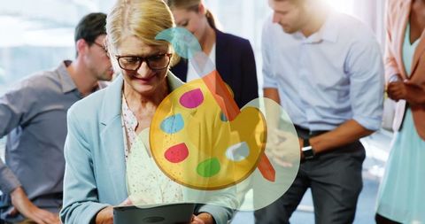 Senior businesswoman in office embracing creativity