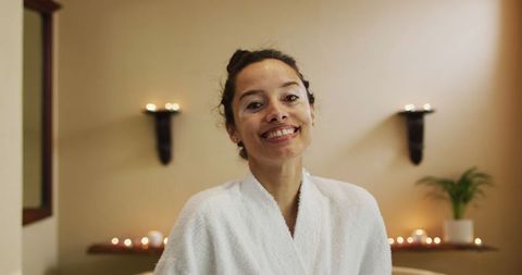 Smiling Woman in Bathrobe Enjoying Relaxation