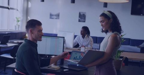 Hispanic Businesswoman Presenting Data in Modern Office