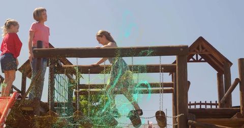 Children Climbing Wooden Playground Frame Under Blue Sky