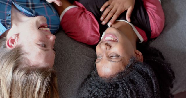 Diverse Friends Lounging on Couch Smiling and Chatting Relaxedly - Download Free Stock Images Pikwizard.com