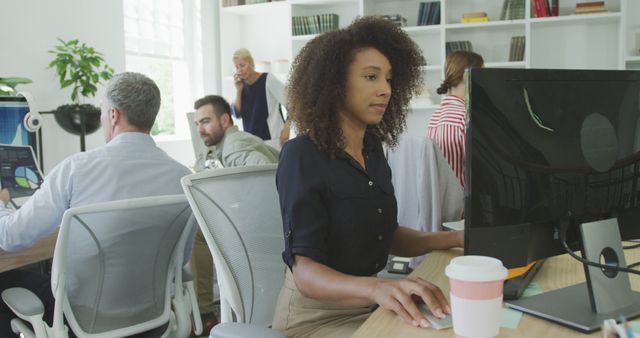 Focused Employees Working in Modern Office Environment - Download Free Stock Photos Pikwizard.com