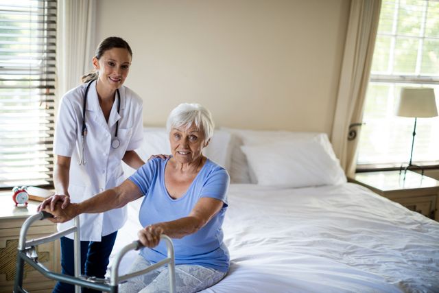 Female doctor assisting senior woman using a walker in a home setting. Ideal for illustrating home healthcare services, elderly care, medical assistance, and rehabilitation support. Useful for websites, brochures, and articles related to senior care, healthcare professionals, and patient support.