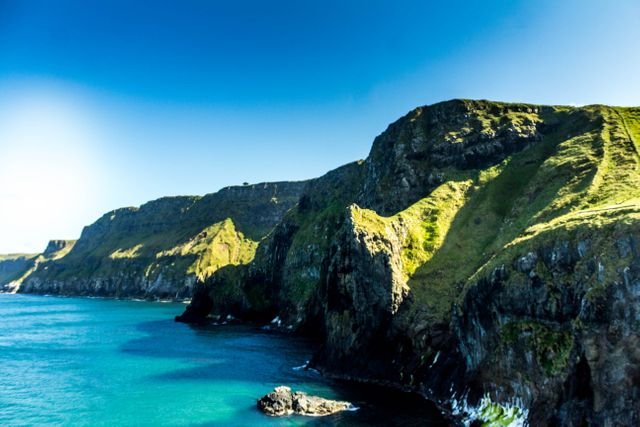 Stunning Coastal Cliffs in Sunlight - Download Free Stock Photos Pikwizard.com