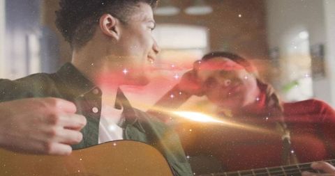 Romantic Couple Strumming Guitar on Cozy Living Room Sofa