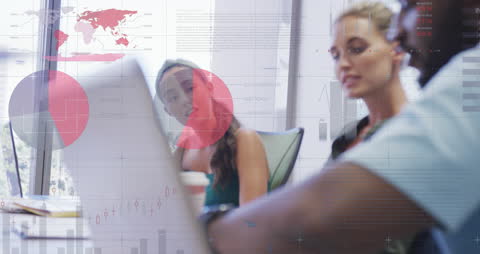 Diverse Team Analyzing Data with Laptop and Digital Graphs