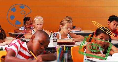 Diverse Schoolchildren Focusing on Classwork with Educational Icons Overlay