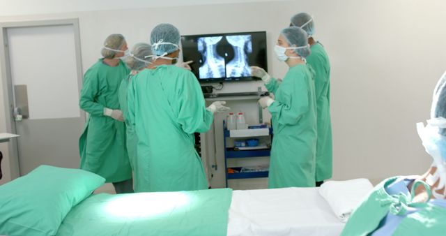 Medical Team Discussing Patient X-Ray in Operating Room - Download Free Stock Images Pikwizard.com