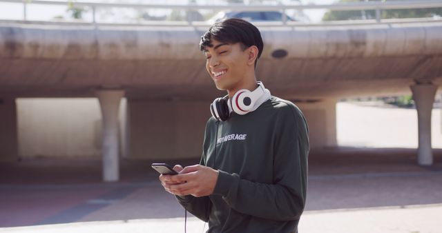 Smiling Young Man Enjoying Music in Urban Setting - Download Free Stock Images Pikwizard.com