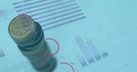 Stack of Coins on Financial Dashboard Displaying Data