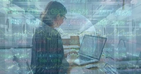 Businesswoman Analyzing Stock Data on Laptop in Modern Office Environment