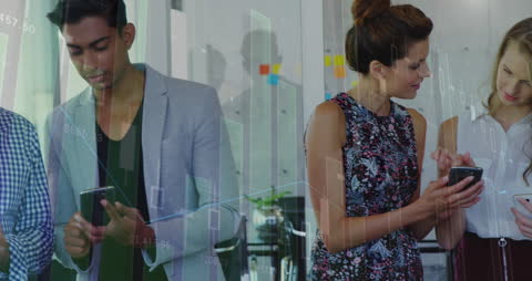 Colleagues Analyzing Digital Data on Smartphones in Office