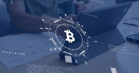Projecting bitcoin hologram over tablet and desk for crypto finance and blockchain trading