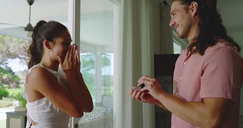 Surprised Woman Receiving Marriage Proposal from Partner
