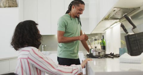 Couple Enjoying Cooking in Modern Kitchen Setting