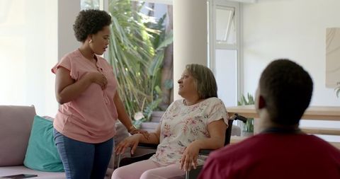 Friendly Interaction with African American Woman in Wheelchair