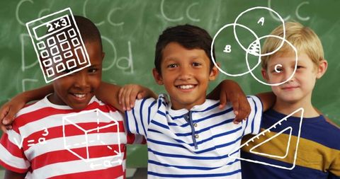 Smiling diverse schoolboys linking arms in classroom with chalk math doodles on board