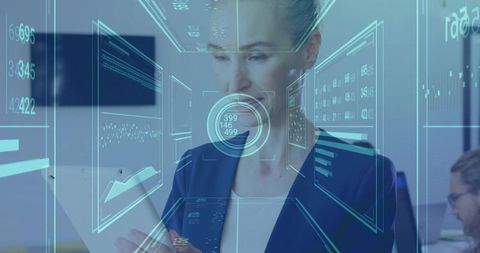 Businesswoman engaging with futuristic holographic interface in office