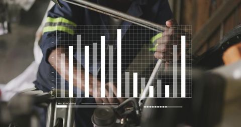 Mechanic gripping pry bar while monitoring performance chart overlay for motorcycle repair