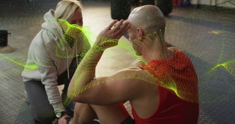 Coach guiding athlete performing core workout with green motion visualization overlay