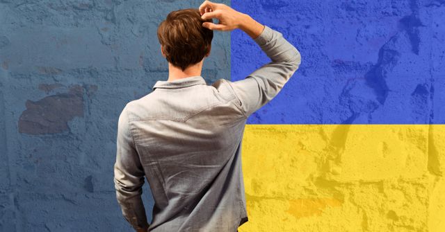 Rear view of thoughtful caucasian man against ukraine flag design background. ukraine crisis, invasion and international relations concept