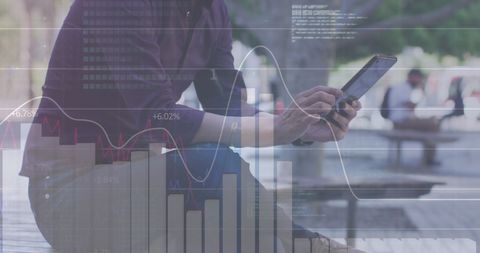 businessman analyzing data on tablet with graph overlays - Download Free Stock Images Pikwizard.com