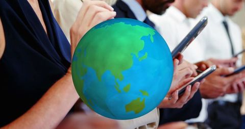 Business Professionals Collaborate with Digital Globe and Smartphones