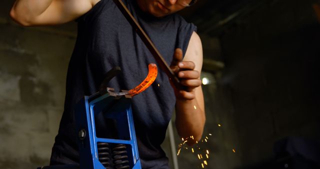 Blacksmith forging glowing hot metal, closeup on sparks and hammer work - Download Free Stock Images Pikwizard.com