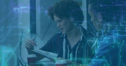 Team Discussing Data Insights with Digital Visualization Elements