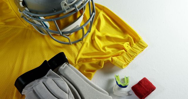 Football Gear on White Background Including Helmet, Jersey, and Mouthguard - Download Free Stock Images Pikwizard.com