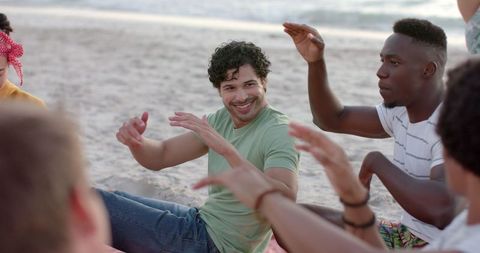 Diverse Friends Laughing and Enjoying Beach Gathering