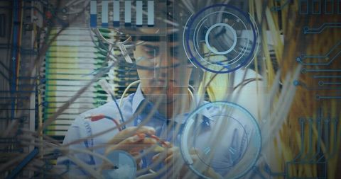 Engineer Working on Data Center Servers with Futuristic Overlay - Download Free Stock Images Pikwizard.com