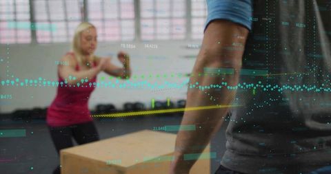 Woman Performing Box Jumps with Fitness Data Overlay in Gym