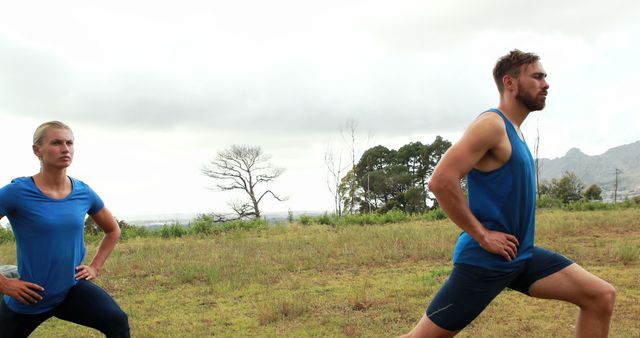 Couple Exercising Outdoors with Lunges in Scenic Countryside - Download Free Stock Images Pikwizard.com