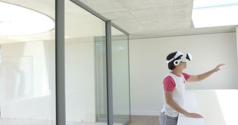 Asian Student Engaged with Virtual Reality Indoors - Download Free Stock Images Pikwizard.com