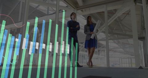 Inspecting modern factory with industry charts overlay