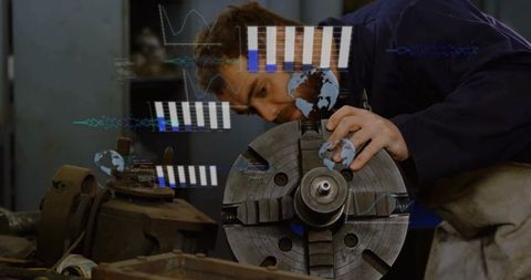 Male machinist analyzing lathe with augmented reality technology in workshop