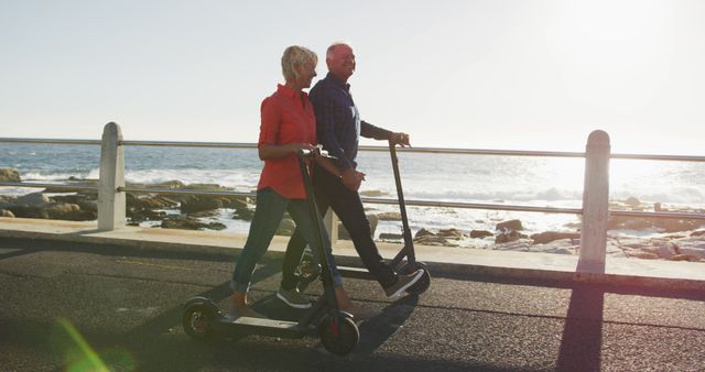 Senior Couple Riding Electric Scooters by Ocean - Download Free Stock Images Pikwizard.com