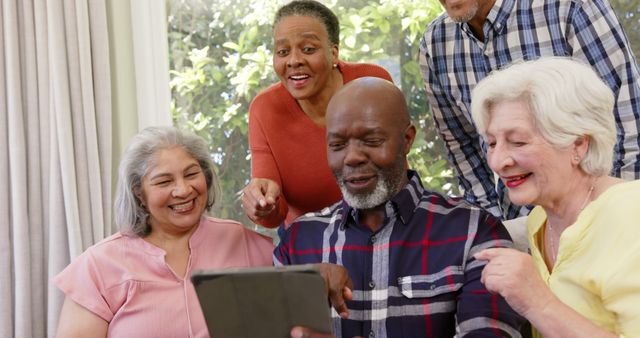 Group of Happy Senior Friends Using Tablet in Cozy Living Room - Download Free Stock Images Pikwizard.com