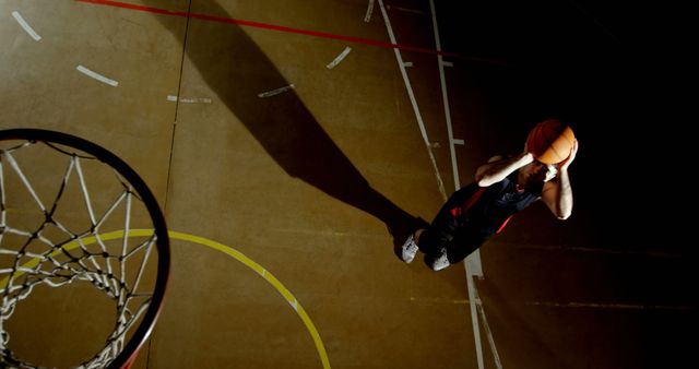 Basketball Player Making Free Throw Shot on Indoor Court with Shadow - Download Free Stock Images Pikwizard.com