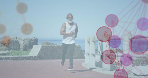 Senior Man Running on Beach with Digital Network Overlay
