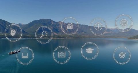 Drone capturing serene alpine lake reflecting mountains with floating digital icons