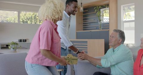 Happy Family Celebrating Gift Giving at Home
